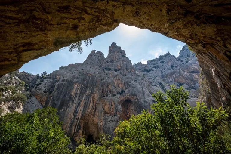 Beautiful huge canyon viewed from below in the cave. Shot in Gola Su Gorropu canyon, Sardinia, Italy - important natural site in Sardinia.