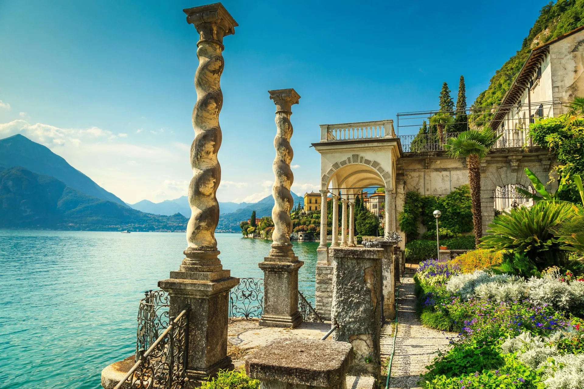 Mediterranean flowers and villa Monastero in background, lake Como, Varenna